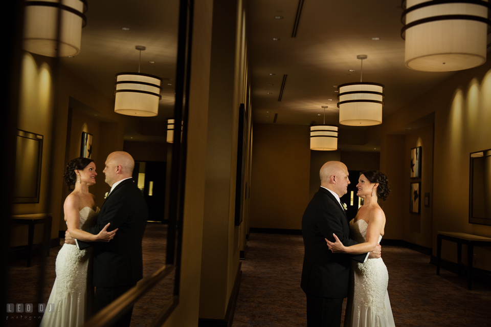 Westin Annapolis Hotel bride and groom holding each other in the hallway photo by Leo Dj Photography