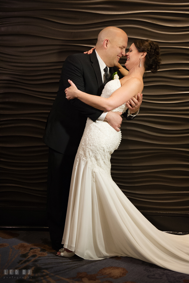 Westin Annapolis Hotel bride and groom laughing while doing semi dip photo by Leo Dj Photography