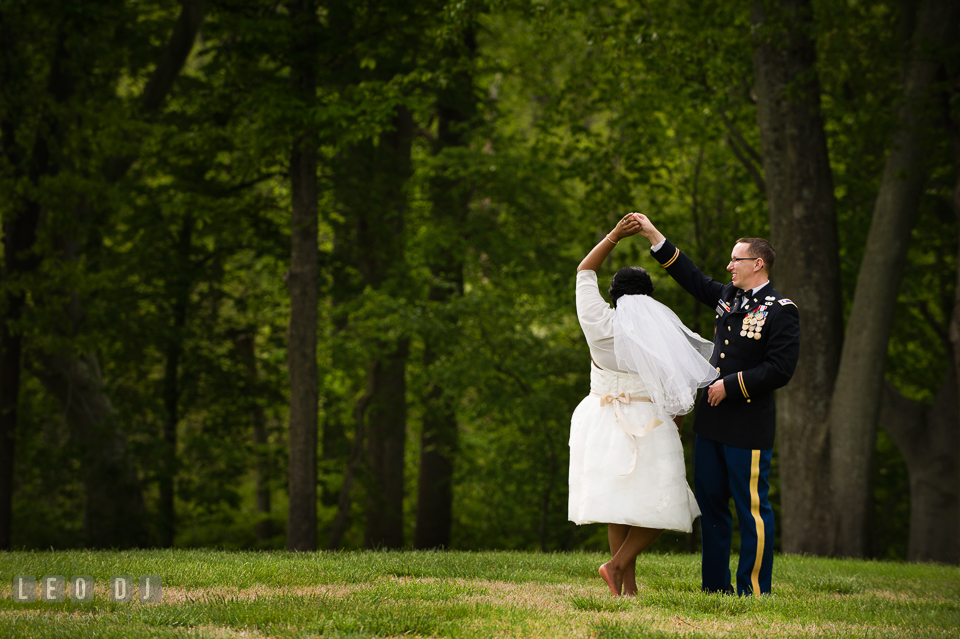 Groom twirling Bride while dancing by the woods. Aspen Wye River Conference Centers wedding at Queenstown Maryland, by wedding photographers of Leo Dj Photography. http://leodjphoto.com