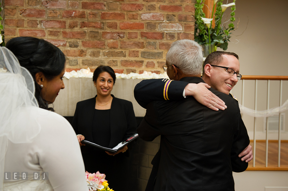 Groom hugging father of the bride. Aspen Wye River Conference Centers wedding at Queenstown Maryland, by wedding photographers of Leo Dj Photography. http://leodjphoto.com