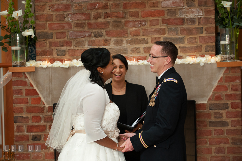 Bride and Groom smiling during exchanging or ring. Aspen Wye River Conference Centers wedding at Queenstown Maryland, by wedding photographers of Leo Dj Photography. http://leodjphoto.com