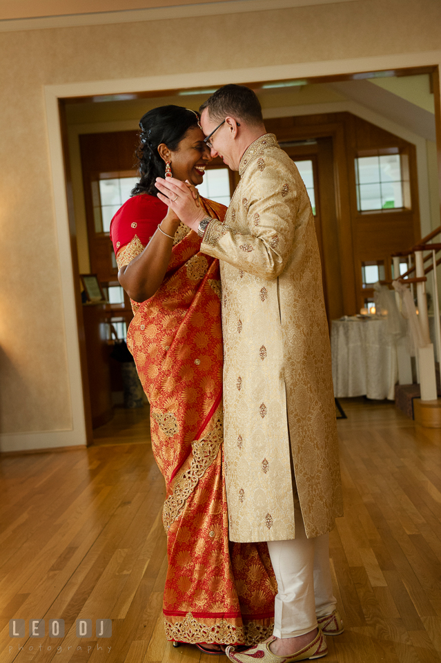 Bride and Groom wearing Indian outfit dancing close to each other. Aspen Wye River Conference Centers wedding at Queenstown Maryland, by wedding photographers of Leo Dj Photography. http://leodjphoto.com