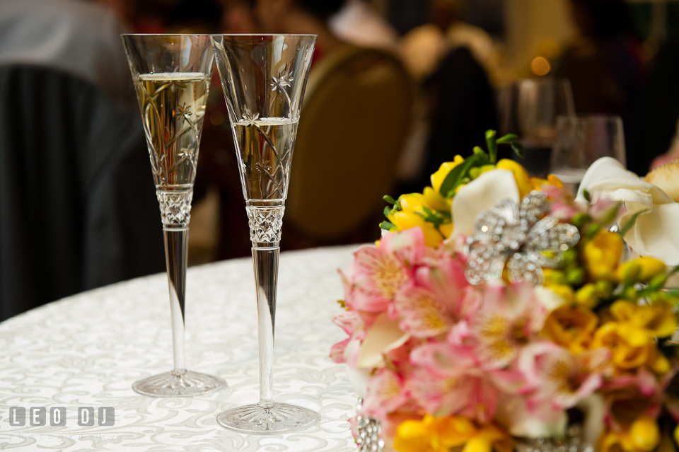 Champagne glasses and Bride's floral bouquet. Aspen Wye River Conference Centers wedding at Queenstown Maryland, by wedding photographers of Leo Dj Photography. http://leodjphoto.com