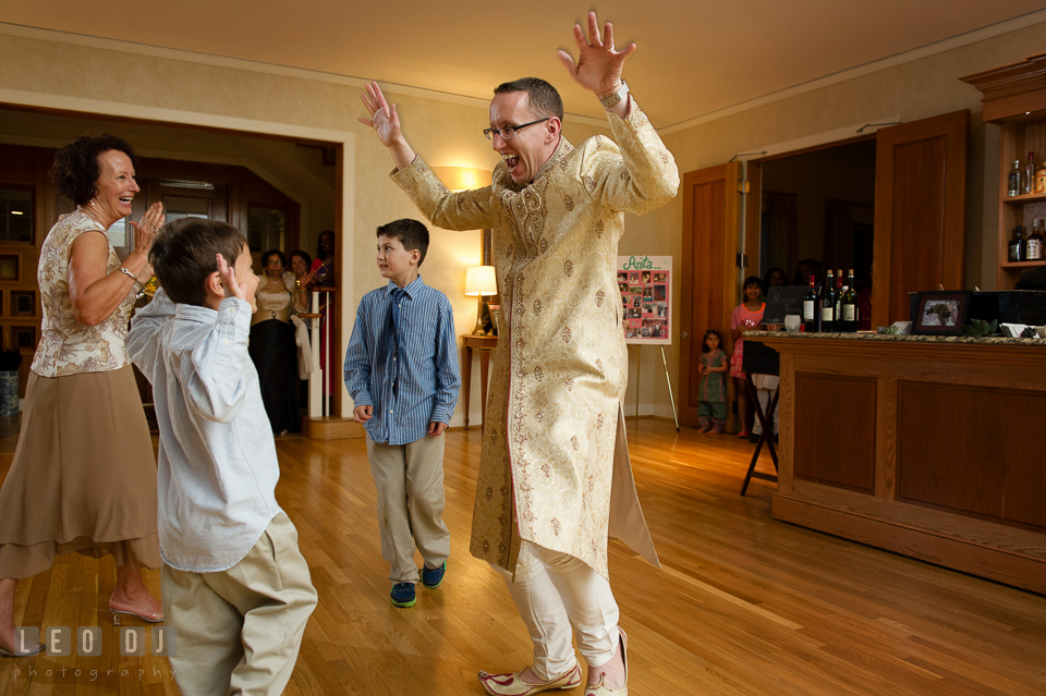 Groom raising hands up in the air during parent dance with his Mother. Aspen Wye River Conference Centers wedding at Queenstown Maryland, by wedding photographers of Leo Dj Photography. http://leodjphoto.com