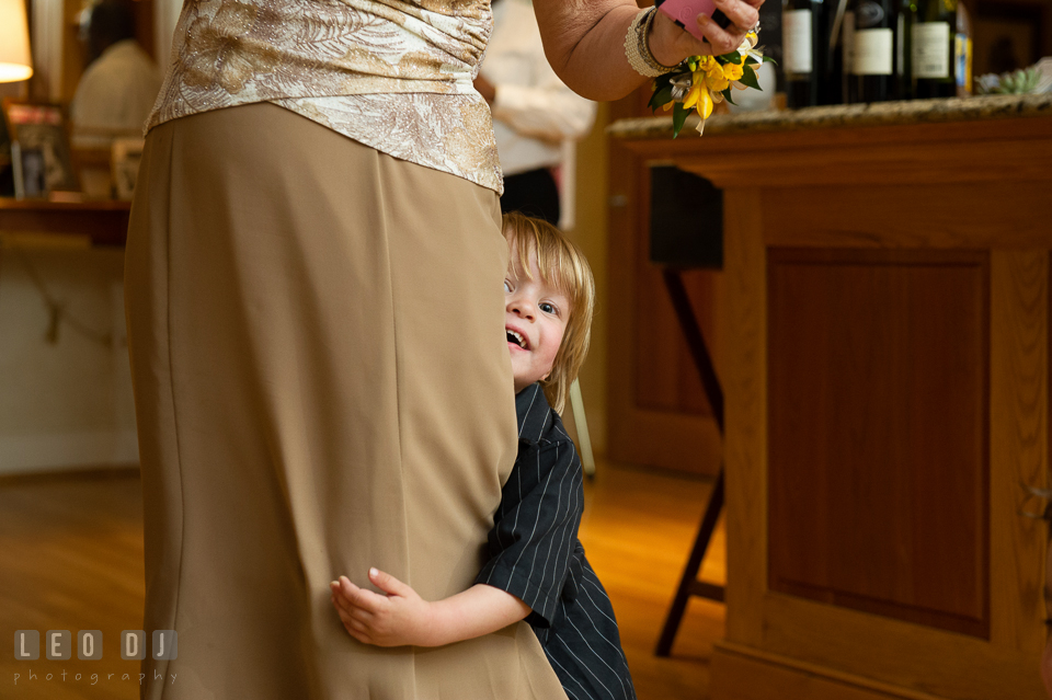 Boy hiding behind his Mother. Aspen Wye River Conference Centers wedding at Queenstown Maryland, by wedding photographers of Leo Dj Photography. http://leodjphoto.com