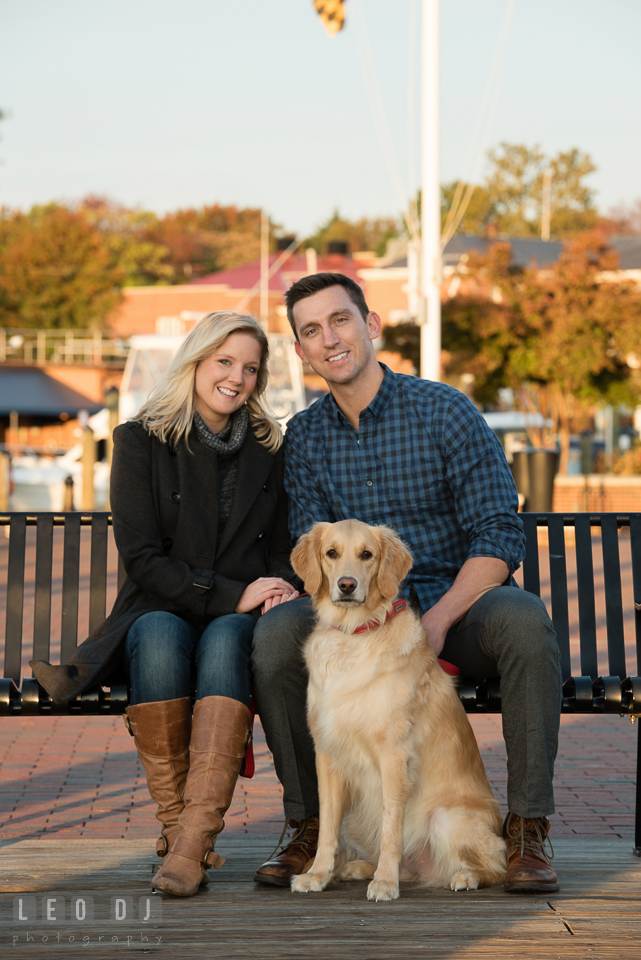 Downtown Annapolis Maryland engaged couple posing with their dog engagement photo by Leo Dj Photography.