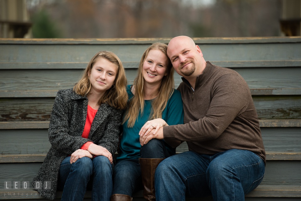 Quiet Waters Park Annapolis Maryland engaged couple with daughter posing together photo by Leo Dj Photography.