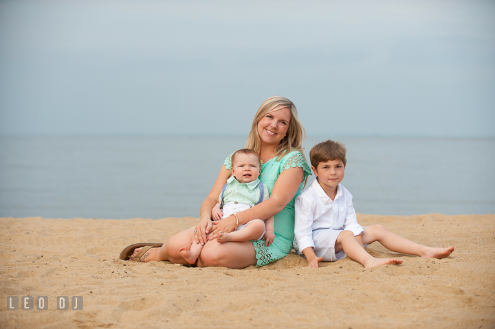 Mother, son, and baby boy posing together on the beach. Chesapeake Bay, Kent Island, Annapolis, Eastern Shore Maryland children and family lifestyle portrait photo session by photographers of Leo Dj Photography. http://leodjphoto.com