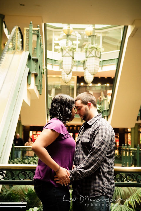 Engaged girl cuddling with her fiancé. Pre wedding engagement photo session at Georgetown, Washington DC by wedding photographer Leo Dj Photography