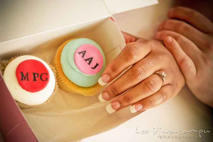 Engaged girl showing her engagement ring by custom made cupcakes by Georgetown Cupcakes. Pre wedding engagement photo session at Georgetown, Washington DC by wedding photographer Leo Dj Photography