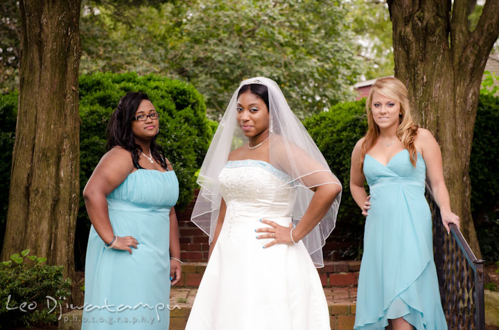 Bride posing with maid of honor and bridesmaid. Kitty Knight House Georgetown Maryland wedding photos by photographers of Leo Dj Photography.