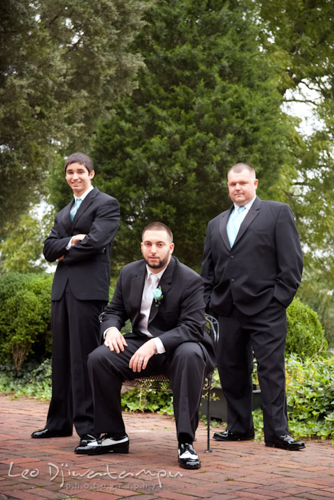 Groom posing with best man and groomsman. Kitty Knight House Georgetown Maryland wedding photos by photographers of Leo Dj Photography.