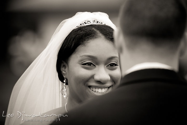 Bride smiling to groom during ceremony. Kitty Knight House Georgetown Maryland wedding photos by photographers of Leo Dj Photography.