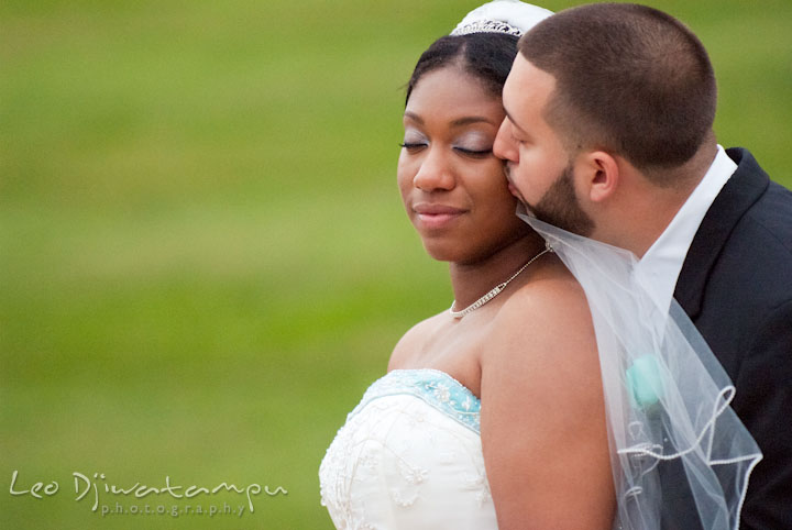 Groom kissing bride. Kitty Knight House Georgetown Maryland wedding photos by photographers of Leo Dj Photography.