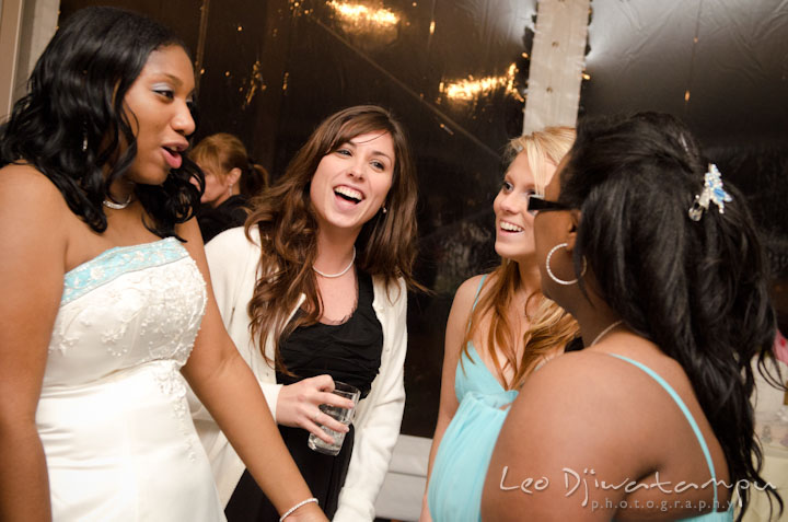 Bride dancing with maid of honor, bridesmaid and guests. Kitty Knight House Georgetown Maryland wedding photos by photographers of Leo Dj Photography.