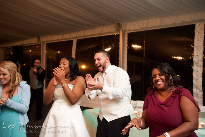 Bride, groom, mother, and matron of honor laughing. Kitty Knight House Georgetown Maryland wedding photos by photographers of Leo Dj Photography.
