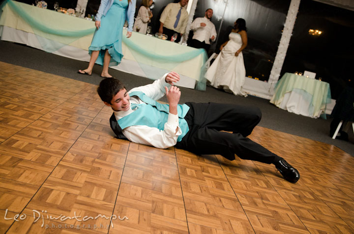 Groom's brother dancing on the floor. Kitty Knight House Georgetown Maryland wedding photos by photographers of Leo Dj Photography.