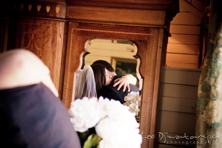 bride having alone time with father before going down the isle, hugging. Clifton Inn Charlottesville VA Destination Wedding Photographer