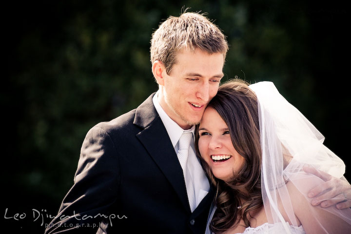 bride and groom cuddling, laughing together. Clifton Inn Charlottesville VA Destination Wedding Photographer