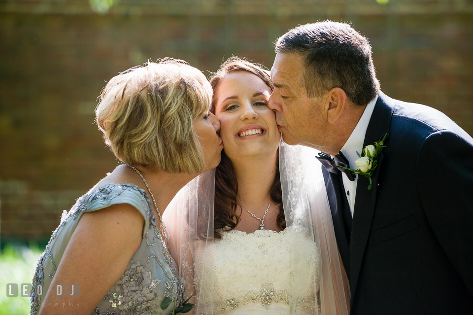 A kiss for the Bride from her proud parents. Aspen Wye River Conference Centers wedding at Queenstown Maryland, by wedding photographers of Leo Dj Photography. http://leodjphoto.com