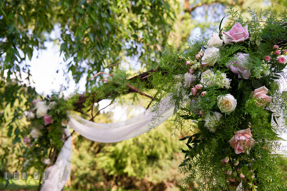 Beautiful arch with pastel colored roses by Monteray Farms florist. Aspen Wye River Conference Centers wedding at Queenstown Maryland, by wedding photographers of Leo Dj Photography. http://leodjphoto.com