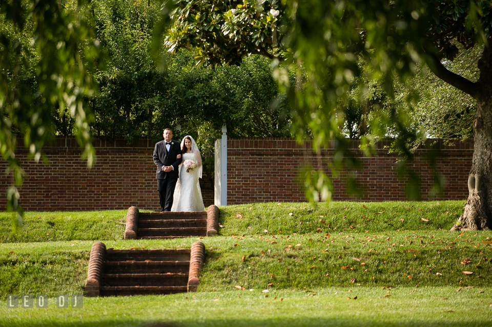 The Father of the Bride escorting his daughter during processional. Aspen Wye River Conference Centers wedding at Queenstown Maryland, by wedding photographers of Leo Dj Photography. http://leodjphoto.com