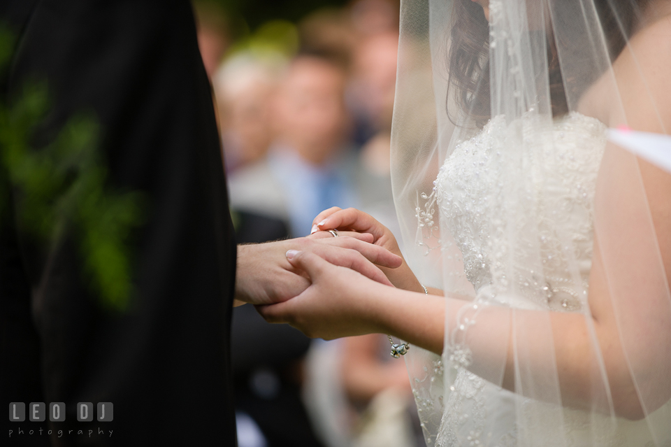 Exchanging wedding bands during the ceremony. Aspen Wye River Conference Centers wedding at Queenstown Maryland, by wedding photographers of Leo Dj Photography. http://leodjphoto.com