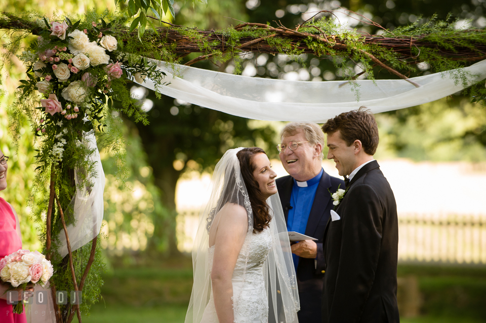 Bride and Groom laughing during ceremony vow. Aspen Wye River Conference Centers wedding at Queenstown Maryland, by wedding photographers of Leo Dj Photography. http://leodjphoto.com