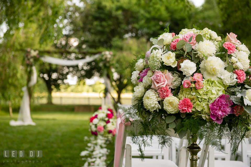 Gorgeous arrays of flower decors and floral petals adorned for the wedding ceremony by Monteray Farms. Aspen Wye River Conference Centers wedding at Queenstown Maryland, by wedding photographers of Leo Dj Photography. http://leodjphoto.com