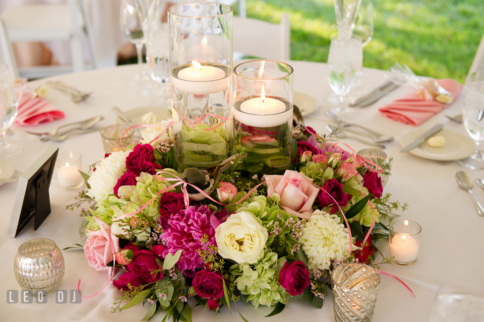 Magnificent table centerpieces of candles and colorful blooms by Monteray Farms. Aspen Wye River Conference Centers wedding at Queenstown Maryland, by wedding photographers of Leo Dj Photography. http://leodjphoto.com