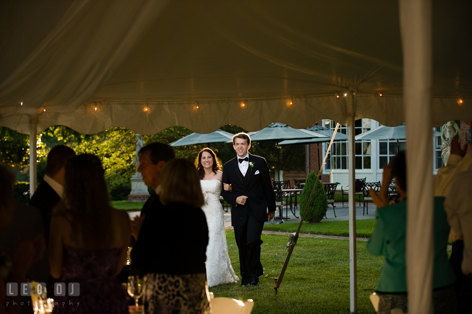 The Bride and Groom entered the wedding reception tent during introduction by DJ Steve Moody. Aspen Wye River Conference Centers wedding at Queenstown Maryland, by wedding photographers of Leo Dj Photography. http://leodjphoto.com