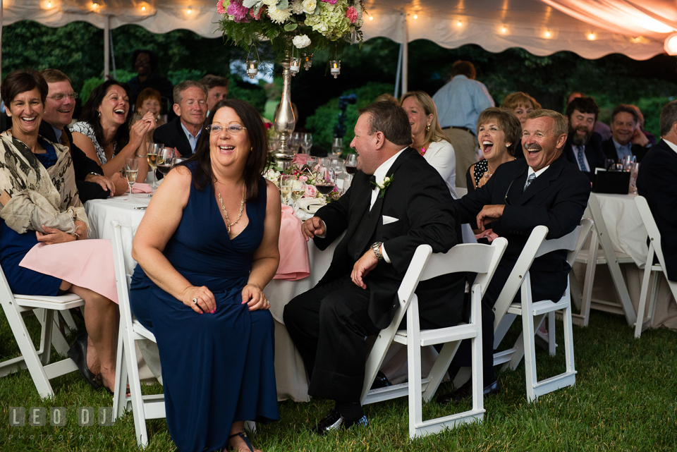 Mother, Father of Groom and guests laughing during toast speech. Aspen Wye River Conference Centers wedding at Queenstown Maryland, by wedding photographers of Leo Dj Photography. http://leodjphoto.com