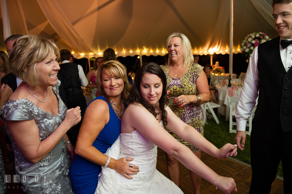 The Bride dancing with guests at the wedding reception. Aspen Wye River Conference Centers wedding at Queenstown Maryland, by wedding photographers of Leo Dj Photography. http://leodjphoto.com