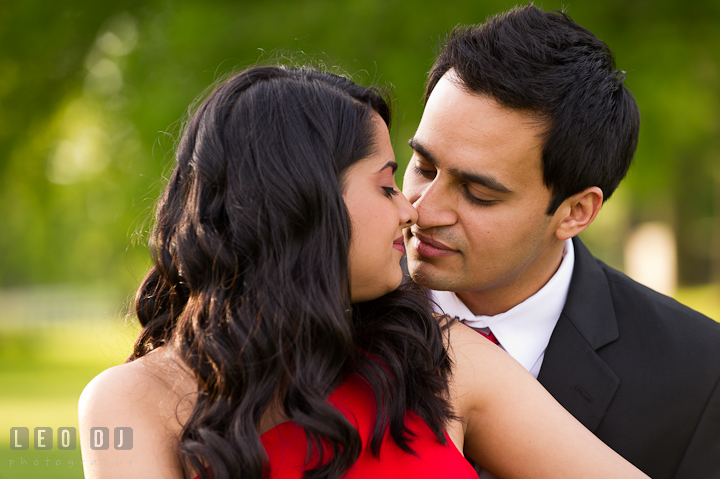 Engaged couple almost kissed. Indian pre-wedding or engagement photo session at Eastern Shore beach, Maryland, by wedding photographers of Leo Dj Photography.