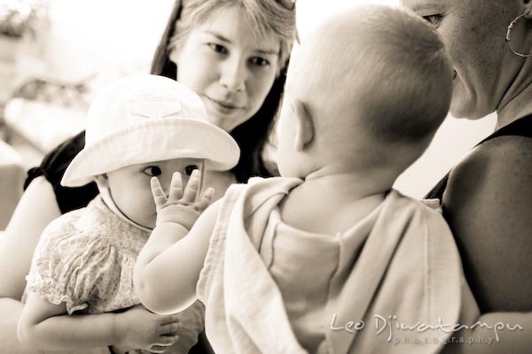 boy waving to girl with hat. baby toddler children candid photography annapolis kent island eastern shore maryland