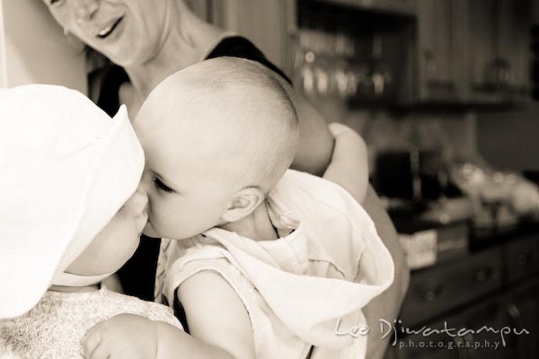 boy kisses girl. baby toddler children candid photography annapolis kent island eastern shore maryland