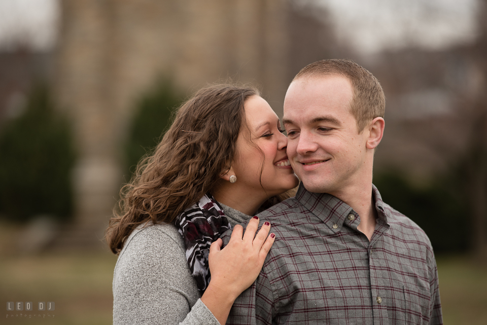 Baker Park Frederick Maryland engaged girl smile and kiss fiancé photo by Leo Dj Photography.