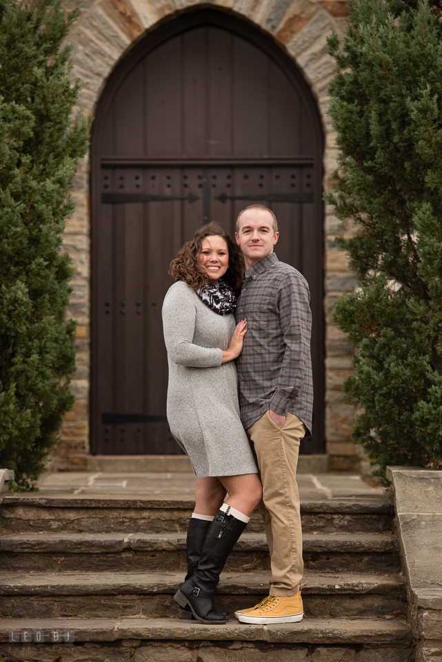 Baker Park Frederick Maryland engaged guy posing with fiance by bell tower photo by Leo Dj Photography.