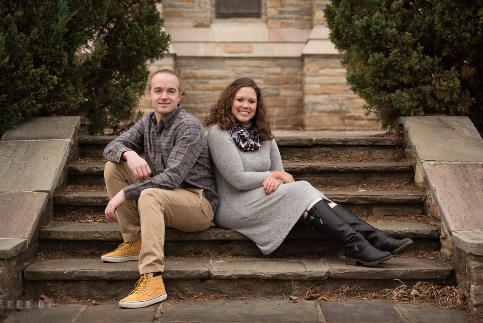 Baker Park Frederick Maryland engaged couple posing by bell tower photo by Leo Dj Photography.