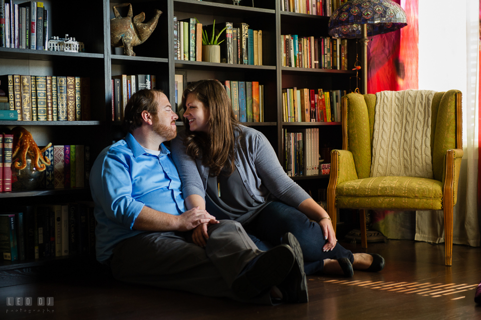 Home Residence Baltimore Maryland engaged man cuddling with fiancee photo by Leo Dj Photography.