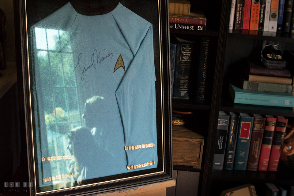 Home Residence Baltimore Maryland engaged couple reflection on Leonard Nimoy signed Star Trek uniform photo by Leo Dj Photography.