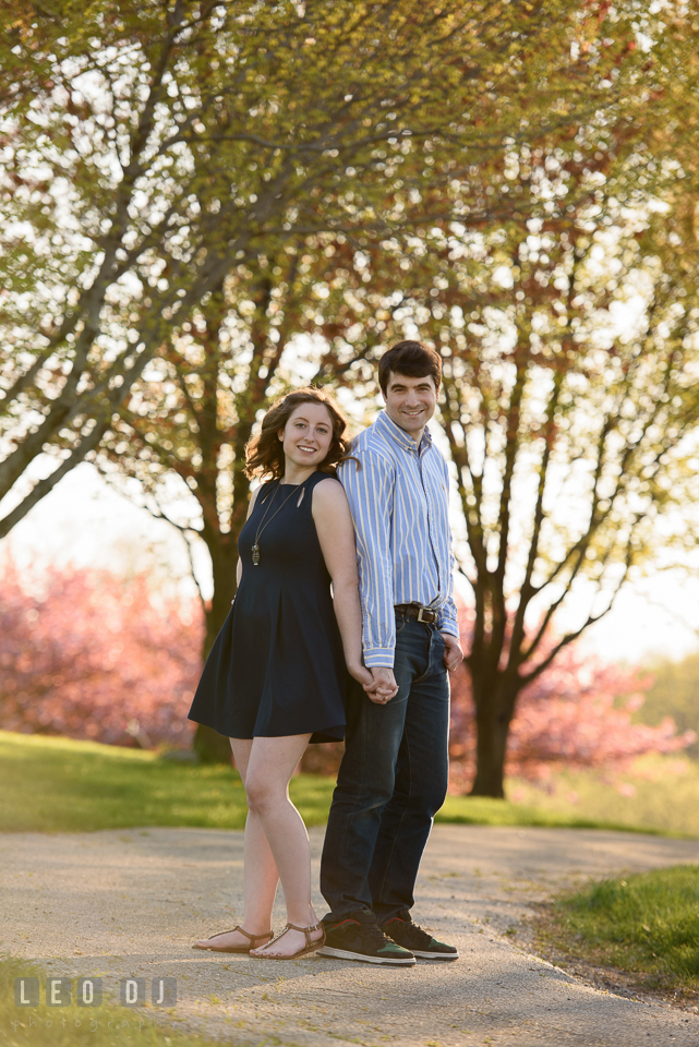 Baltimore Rowing Club Maryland engaged couple holding hands photo by Leo Dj Photography.