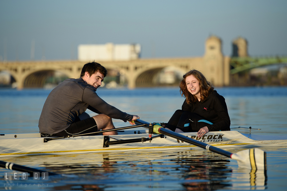 Baltimore Rowing Club Maryland engaged girl laughing as fiance rowing boat in Patapsco River photo by Leo Dj Photography.