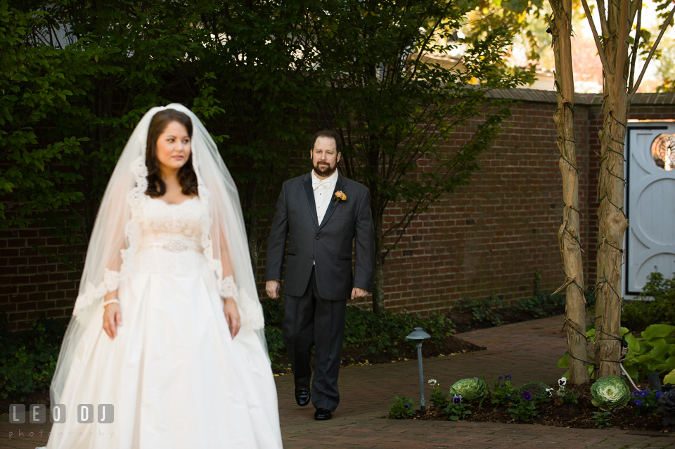 Groom walking toward Bride during their first look before the ceremony. The Tidewater Inn wedding, Easton, Eastern Shore, Maryland, by wedding photographers of Leo Dj Photography. http://leodjphoto.com