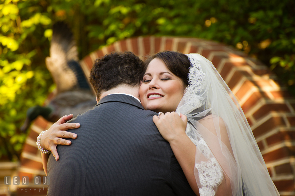 Bride and Groom hugging during their first glance. The Tidewater Inn wedding, Easton, Eastern Shore, Maryland, by wedding photographers of Leo Dj Photography. http://leodjphoto.com