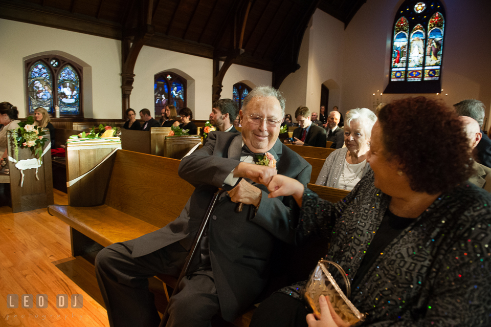 Father of the Groom and his daughter giving fist bump. The Trinity Cathedral wedding, Easton, Eastern Shore, Maryland, by wedding photographers of Leo Dj Photography. http://leodjphoto.com