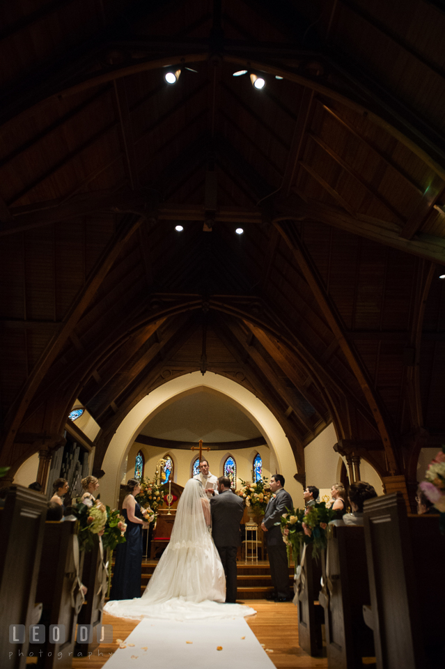 Bride and Groom listening to speech from the church pastor. The Trinity Cathedral wedding, Easton, Eastern Shore, Maryland, by wedding photographers of Leo Dj Photography. http://leodjphoto.com