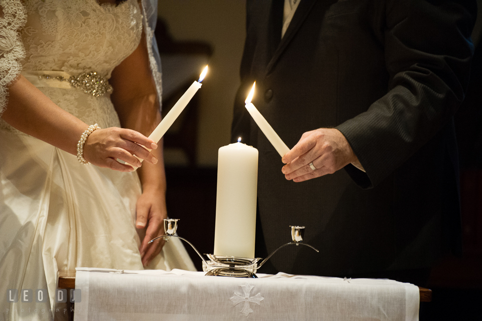 Bride and Groom holding the unity candles. The Trinity Cathedral wedding, Easton, Eastern Shore, Maryland, by wedding photographers of Leo Dj Photography. http://leodjphoto.com