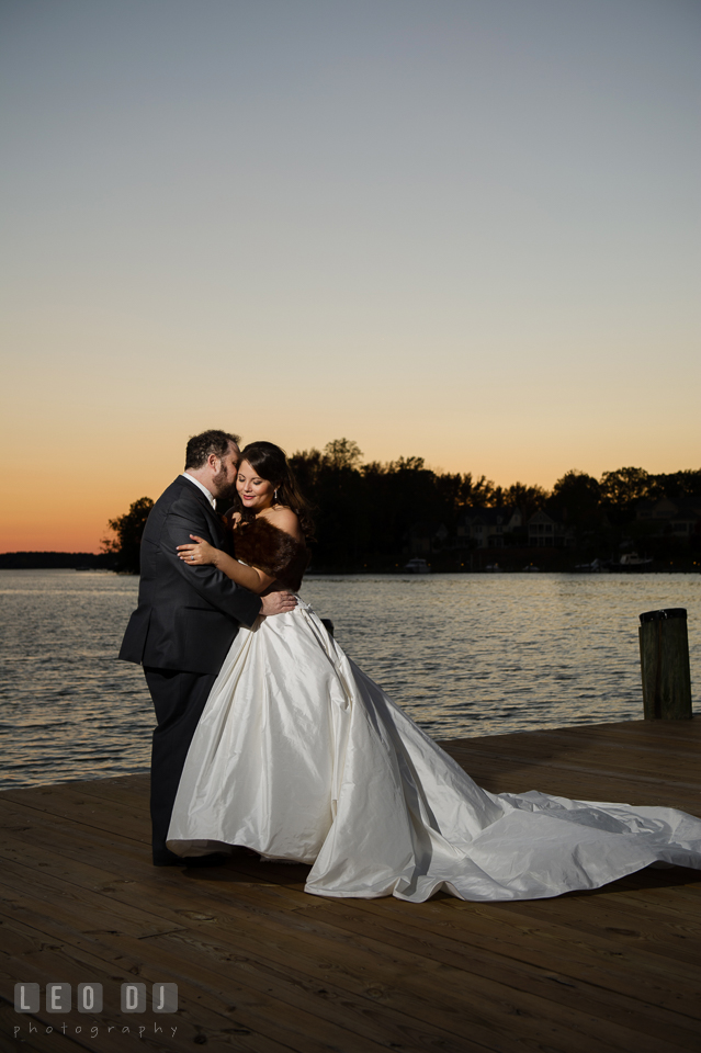 Bride and Groom kissing on the dock during sunset. The Tidewater Inn wedding, Easton, Eastern Shore, Maryland, by wedding photographers of Leo Dj Photography. http://leodjphoto.com