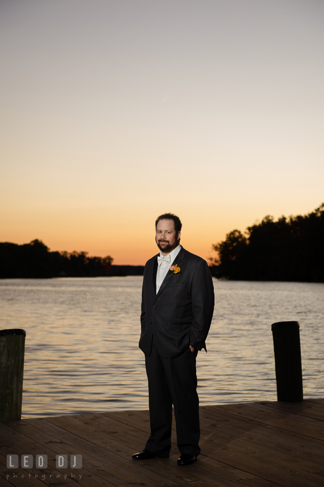 Groom posing by the water during sunset. The Tidewater Inn wedding, Easton, Eastern Shore, Maryland, by wedding photographers of Leo Dj Photography. http://leodjphoto.com